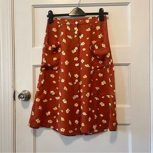 Orange floral midi skirt with pockets